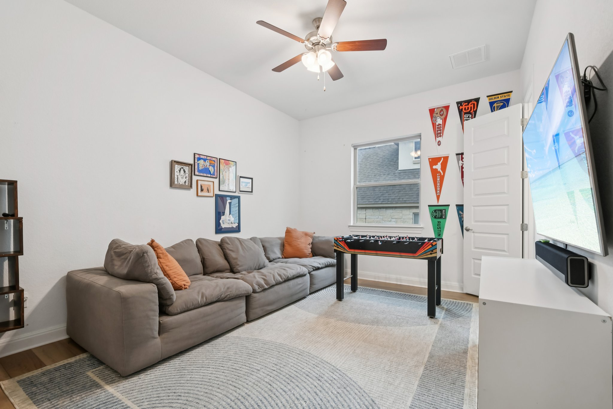 561 Eclipse Drive Austin, TX 78737 - Photo 21 of 36 Living room with wood finished floors and ceiling fan