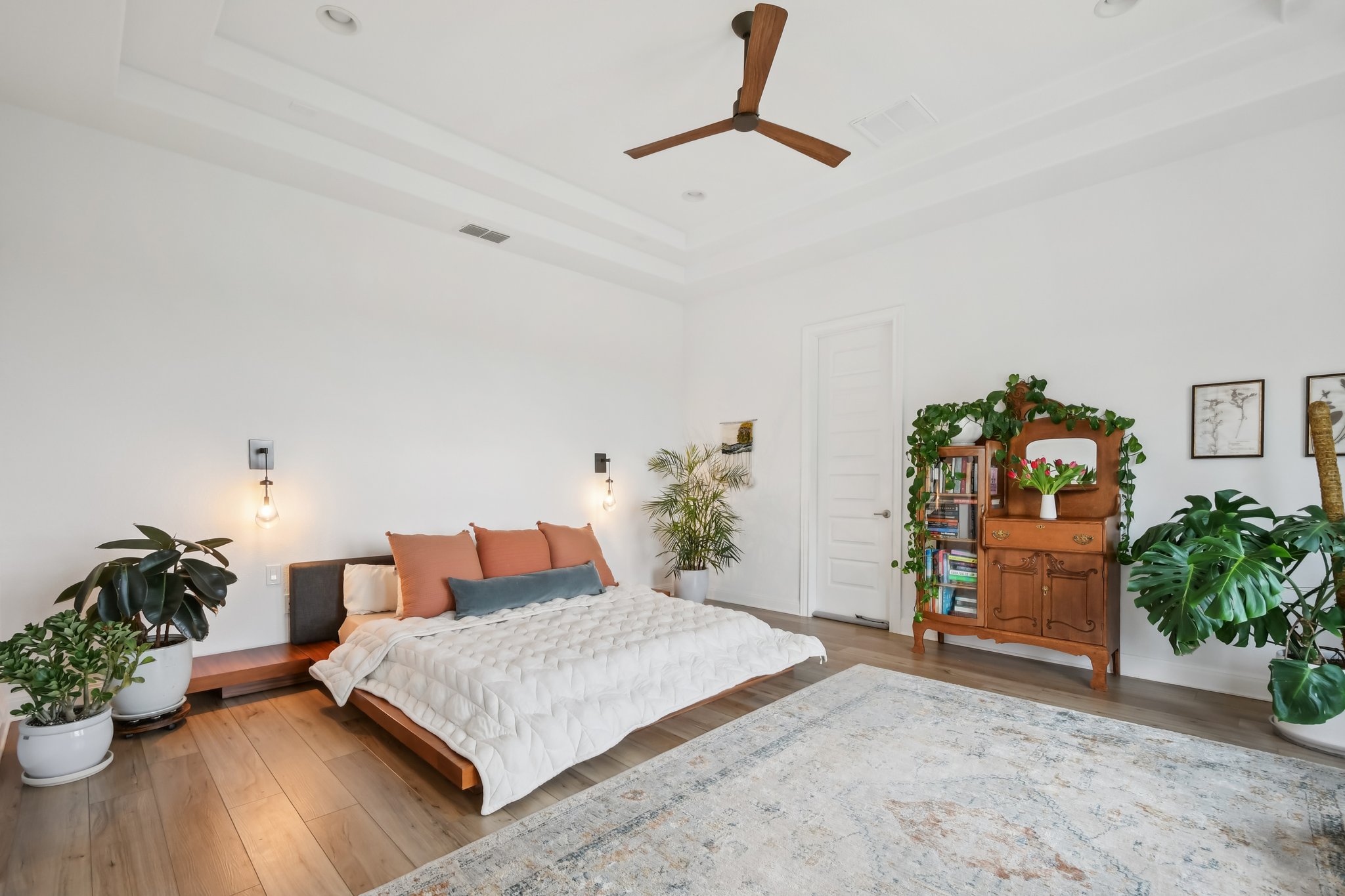561 Eclipse Drive Austin, TX 78737 - Photo 24 of 36 Bedroom with a raised ceiling, wood finished floors, a ceiling fan, and recessed lighting