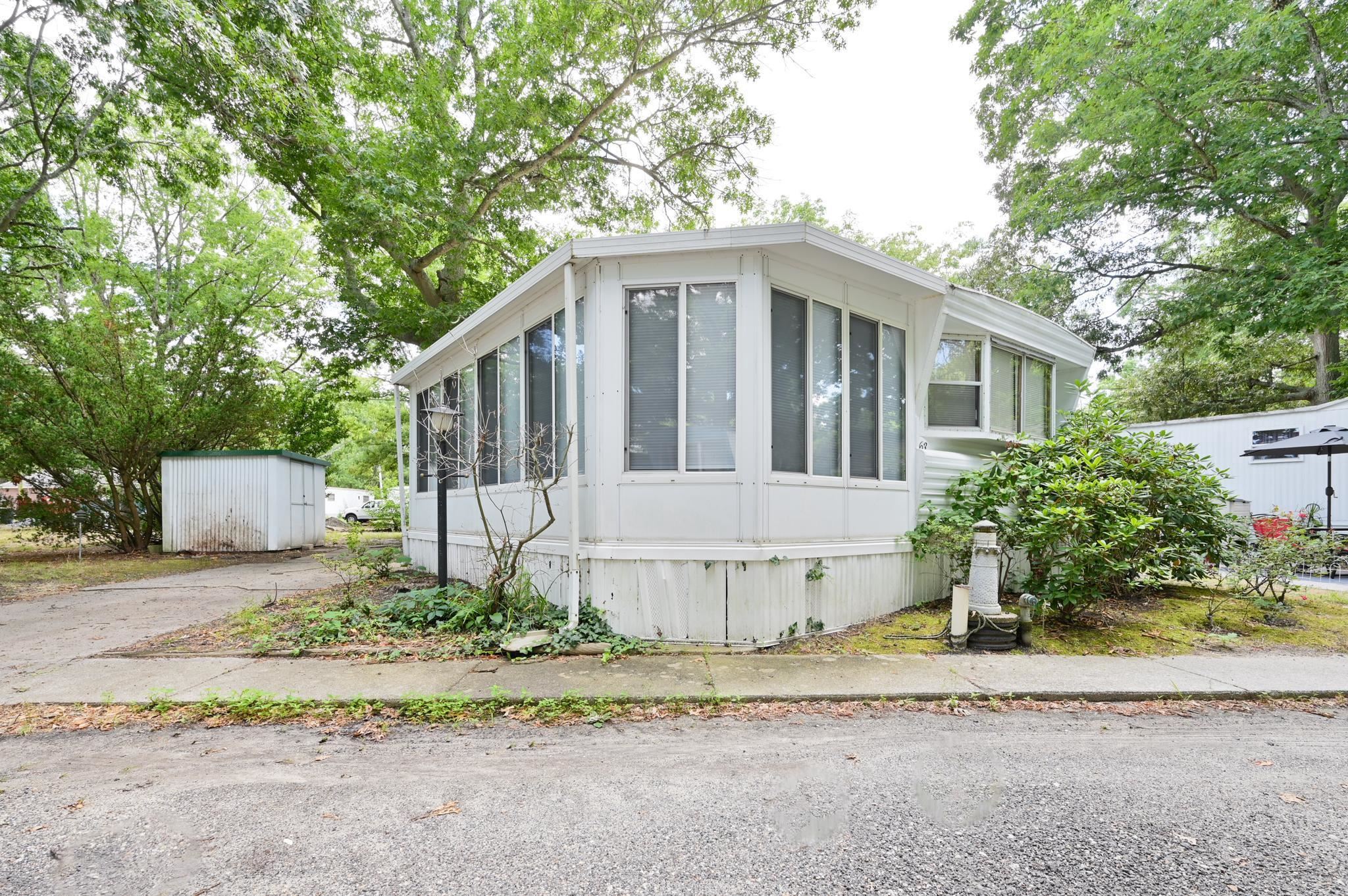 63 Ferren Rio Grande, NJ 08242 - Photo 1 of 22 a front view of a house with a garden and plants