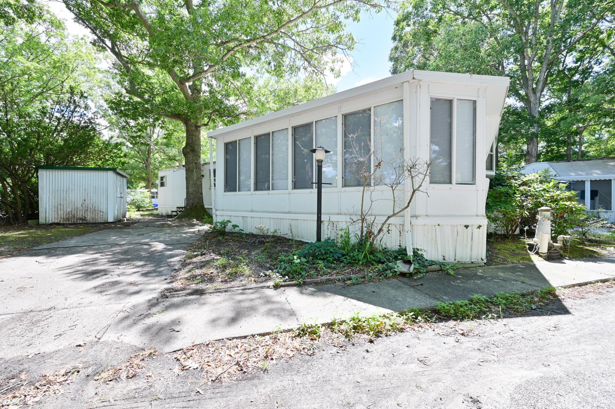63 Ferren Rio Grande, NJ 08242 - Photo 4 of 22 a view of a grey house with a yard