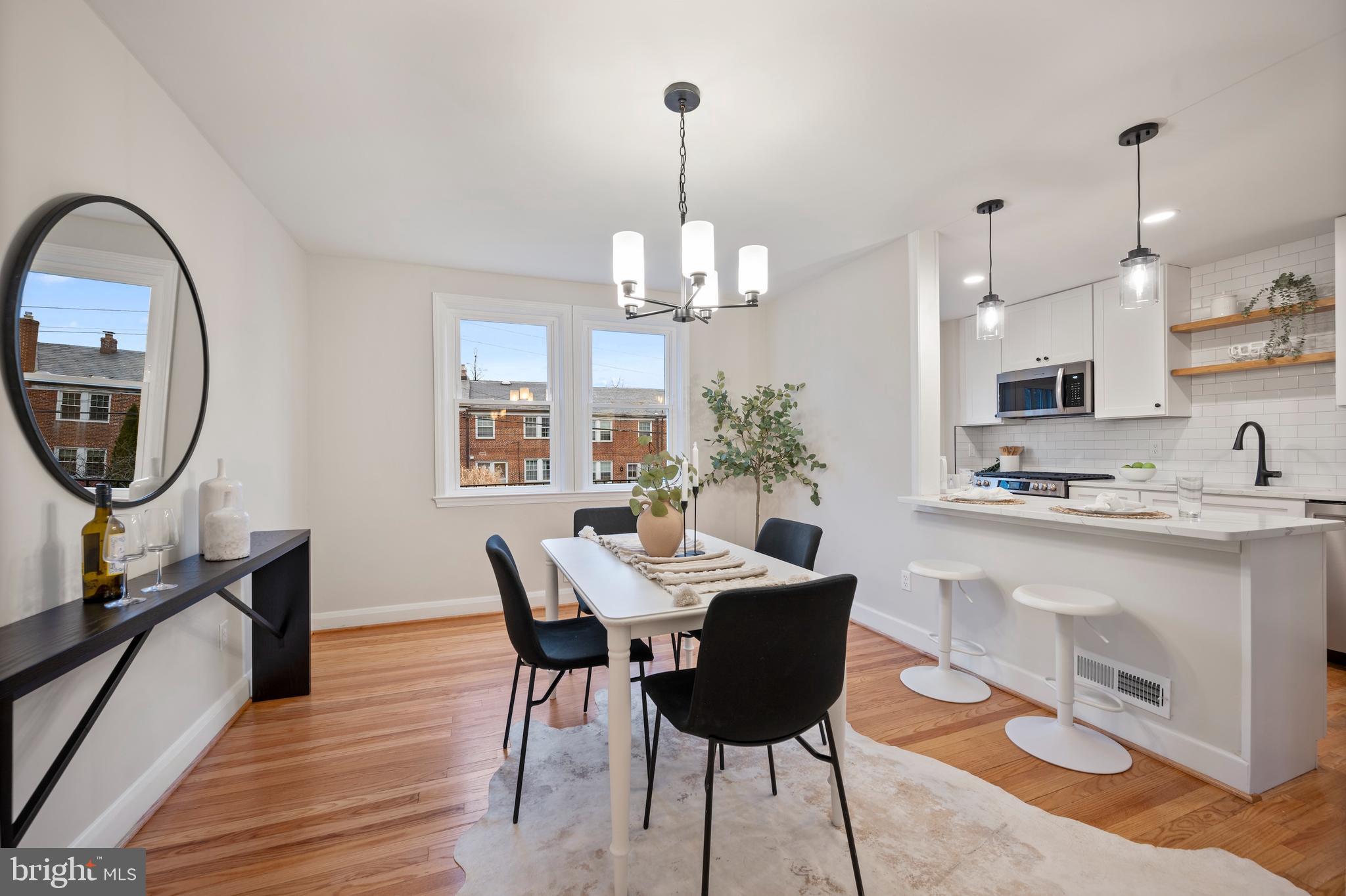 323 Stratford Road Baltimore, MD 21228 - Photo 12 of 35 a view of a dining room with furniture and chandelier