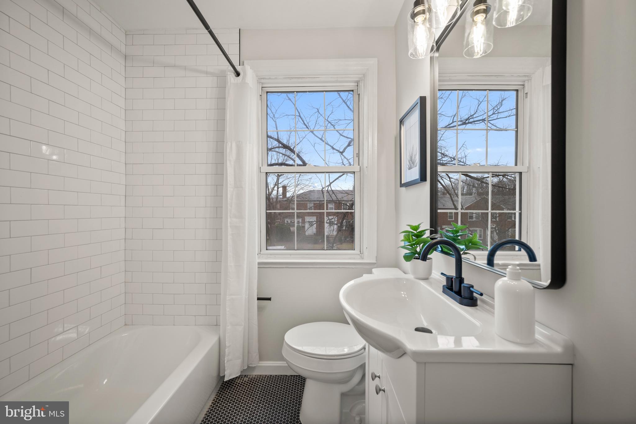 323 Stratford Road Baltimore, MD 21228 - Photo 20 of 35 a bathroom with a sink toilet and shower