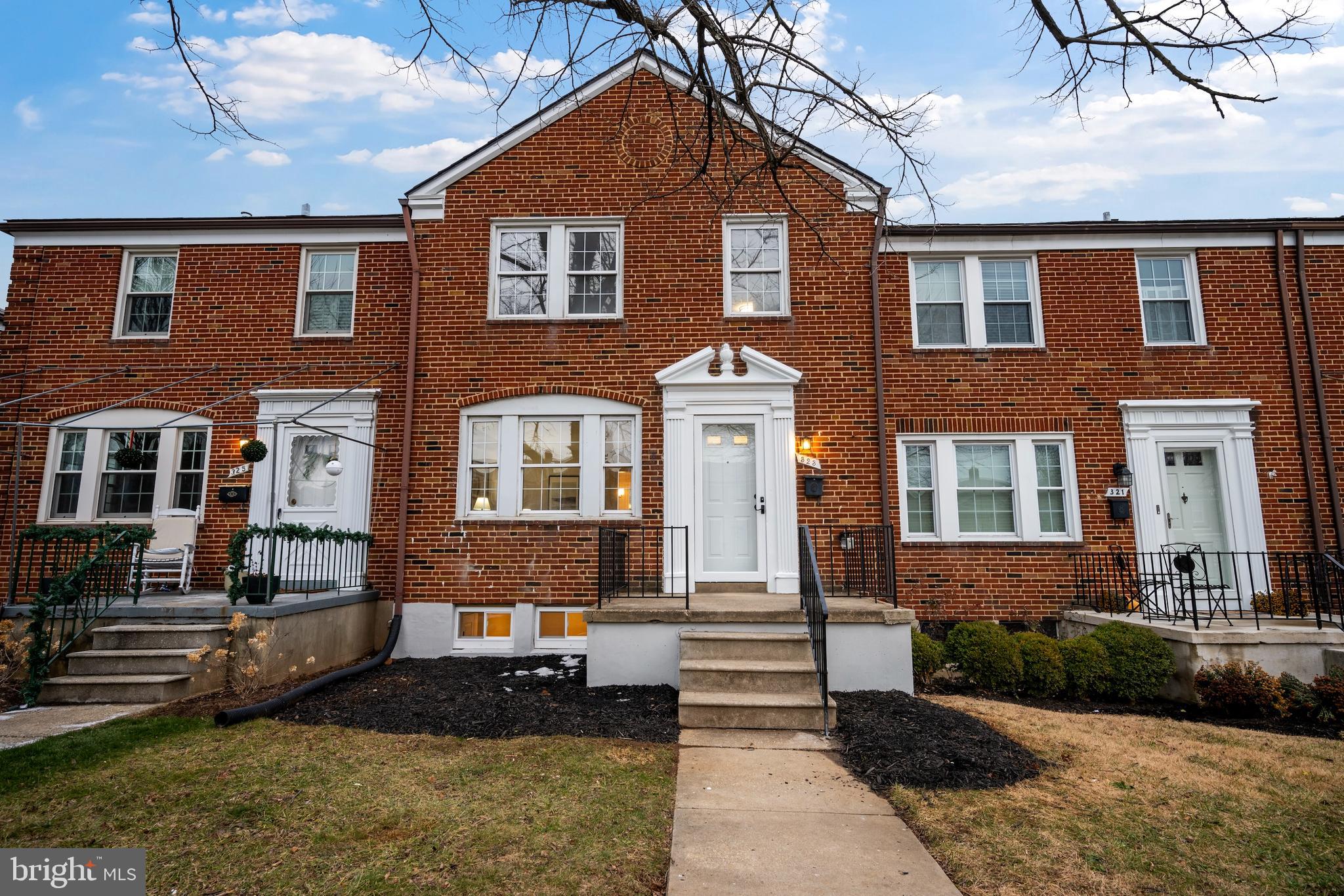 323 Stratford Road Baltimore, MD 21228 - Photo 31 of 35 a front view of a house with a yard