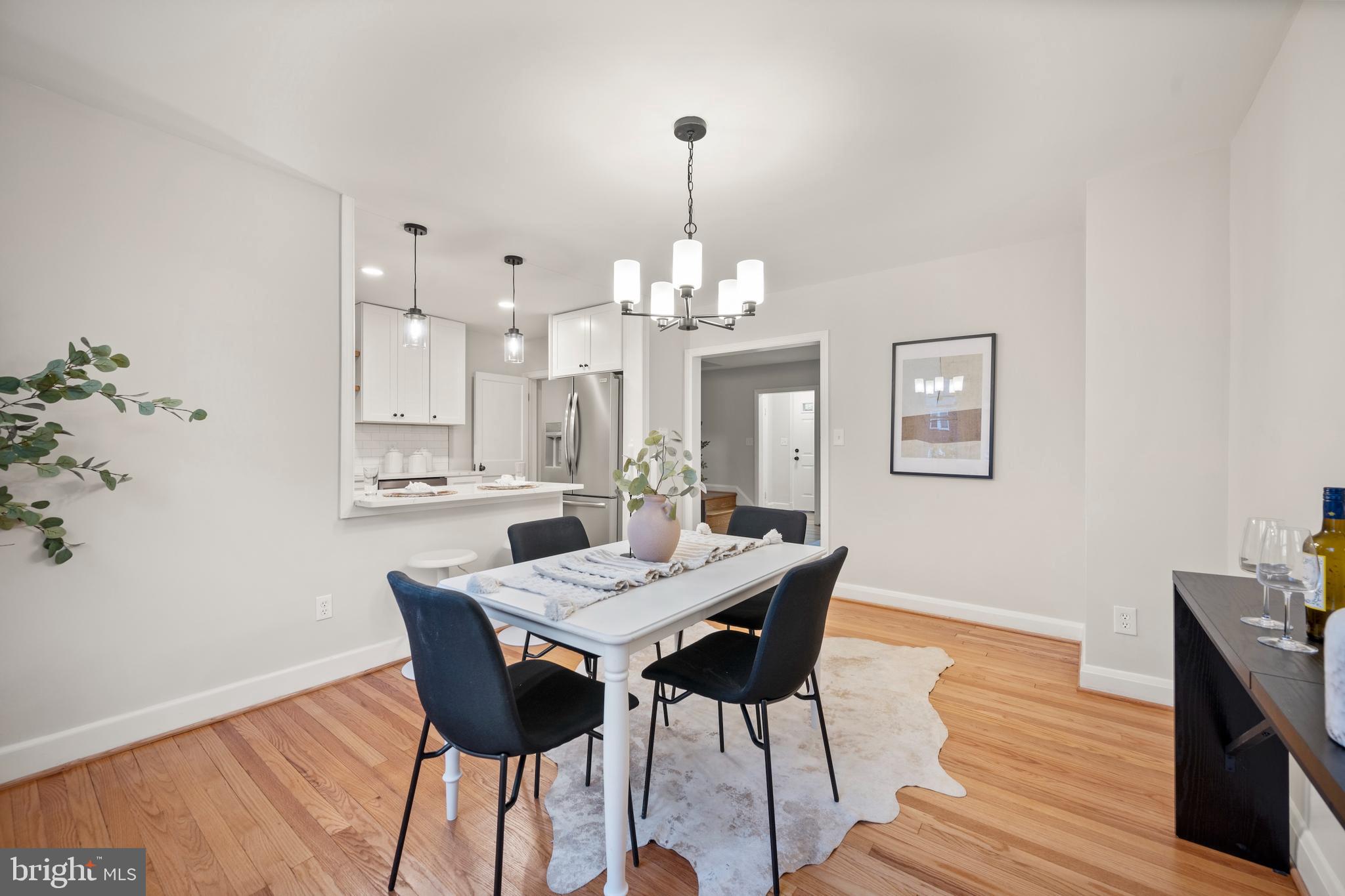 323 Stratford Road Baltimore, MD 21228 - Photo 9 of 35 a view of a dining room with furniture and wooden floor