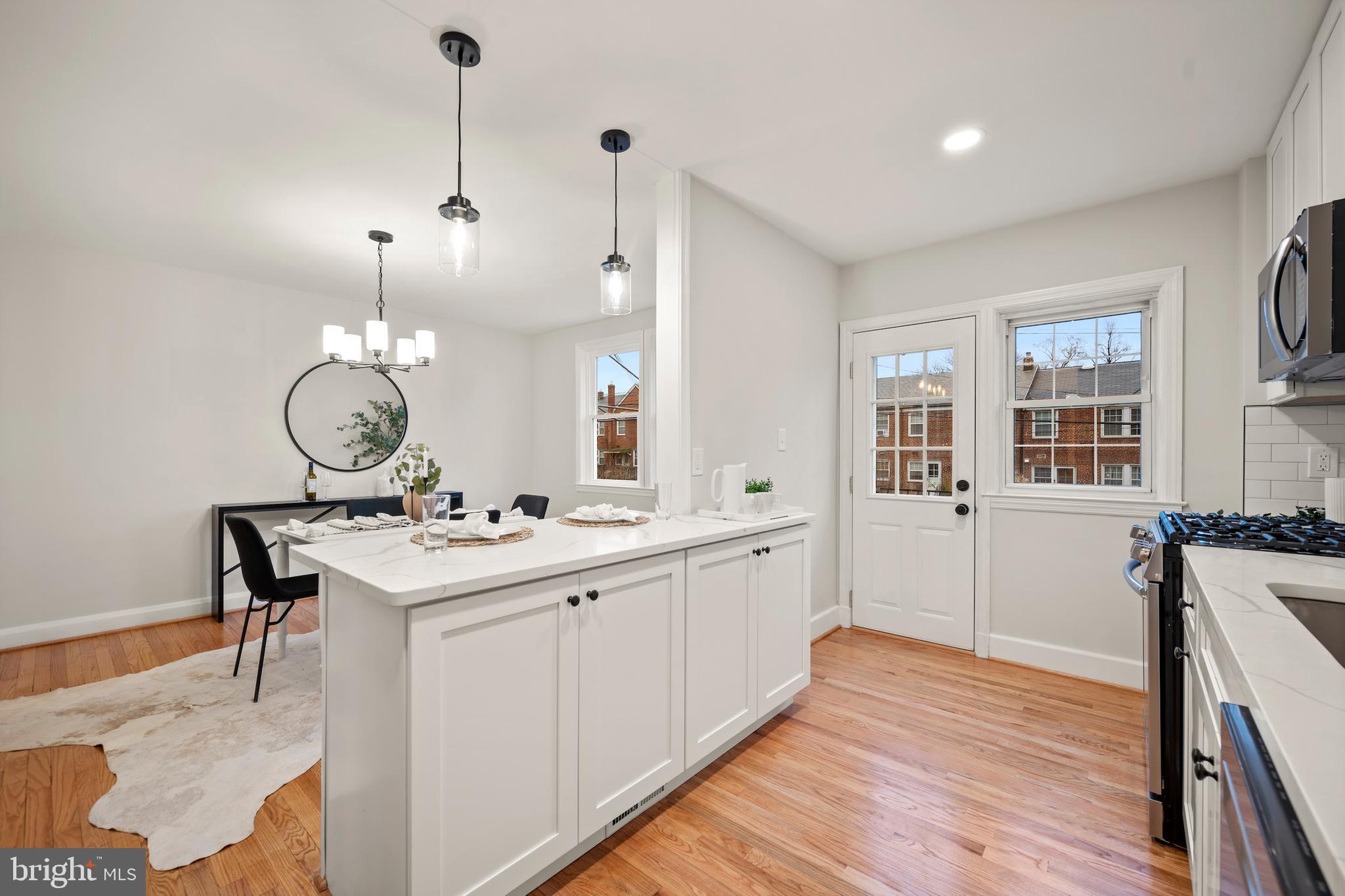 323 Stratford Road Baltimore, MD 21228 - Photo 10 of 35 a kitchen with a sink and cabinets