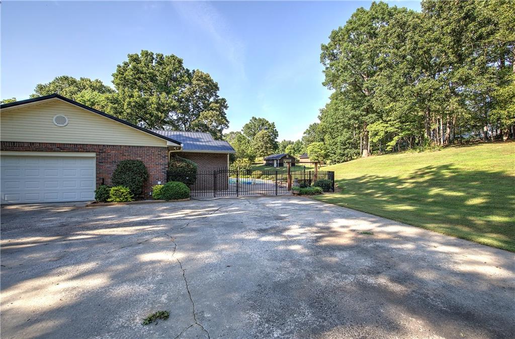 408 Mac Johnson Road Northwest Cartersville, GA 30121 - Photo 57 of 79 a view of a house with backyard and a tree