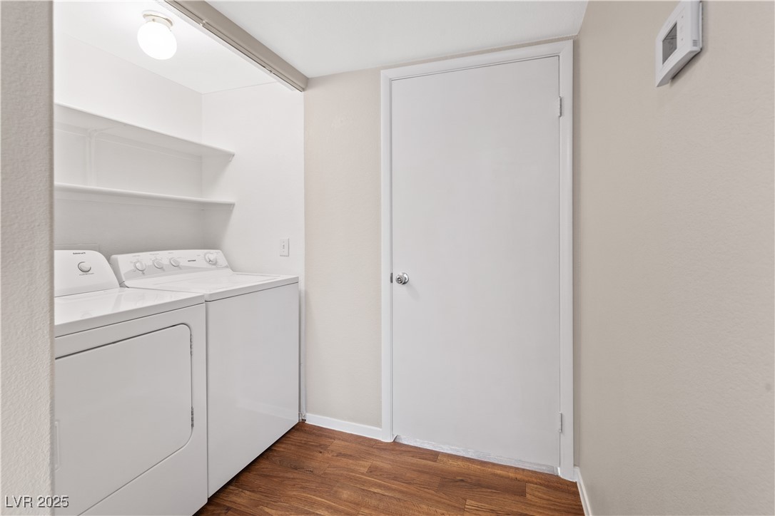 7950 West Flamingo Road, Unit 1039 Las Vegas, NV 89147 - Photo 19 of 26 Laundry area featuring dark wood-style floors and washer and dryer