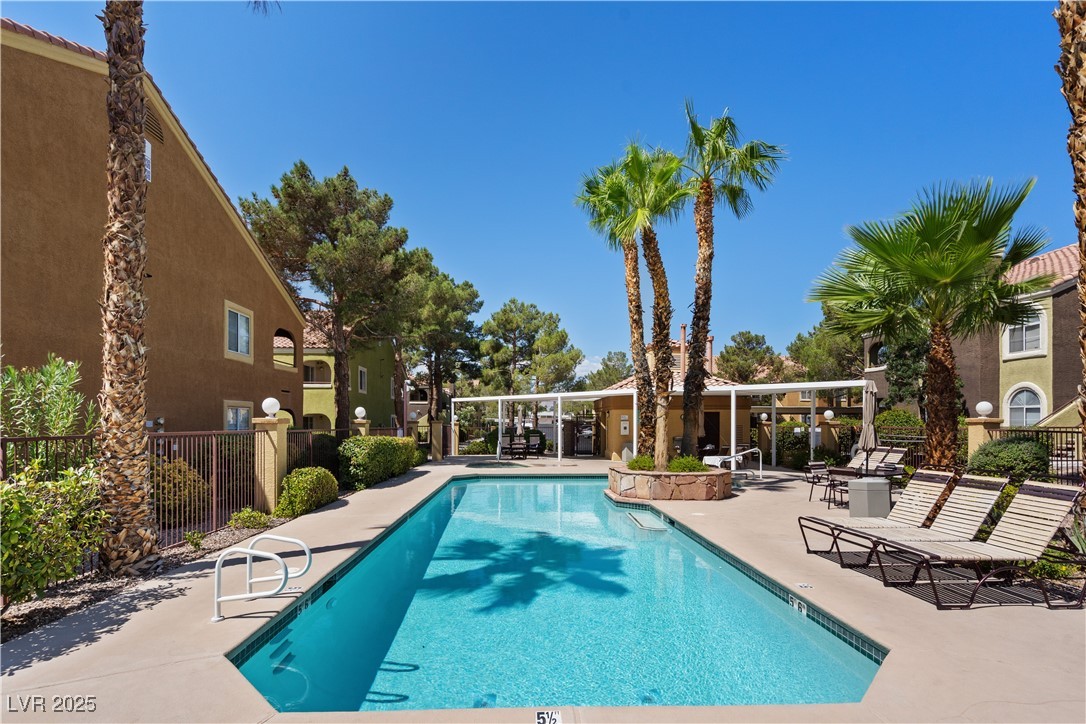7950 West Flamingo Road, Unit 1039 Las Vegas, NV 89147 - Photo 4 of 26 Community pool with a patio area