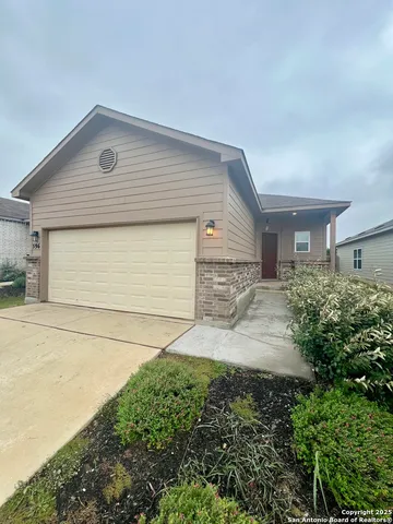 a front view of a house with garage