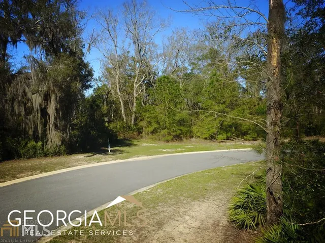 a view of a swimming pool with an trees