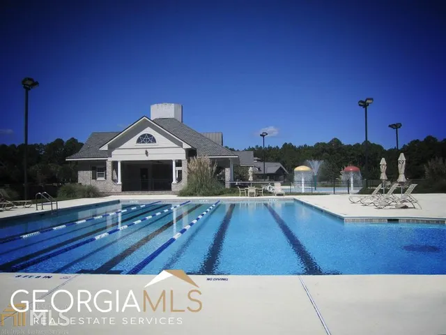a view of a house with swimming pool