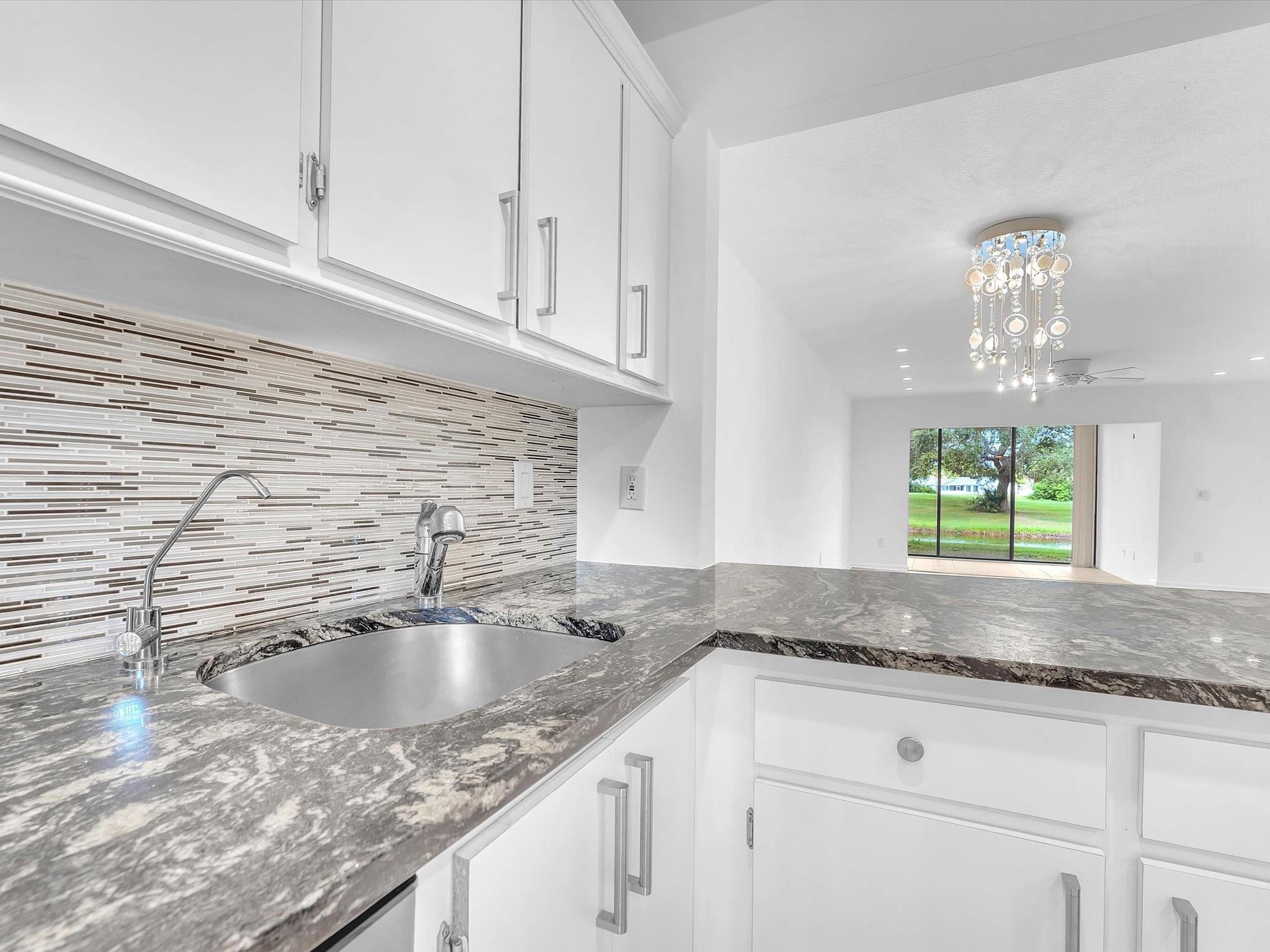 9290 Vista Del Lago, Unit E Boca Raton, FL 33428 - Photo 17 of 39 Passthrough to dining area