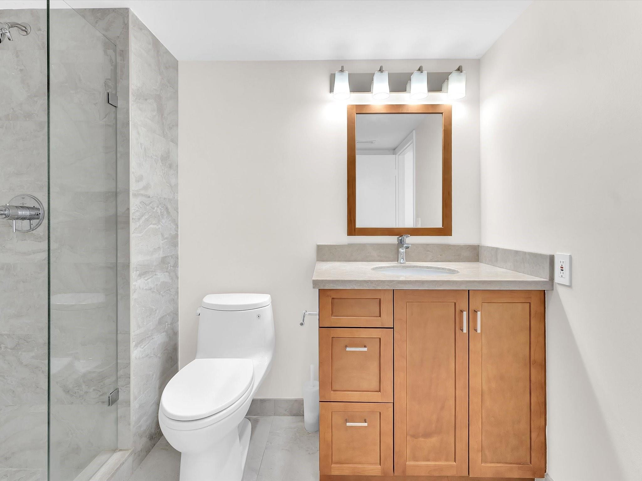 9290 Vista Del Lago, Unit E Boca Raton, FL 33428 - Photo 20 of 39 Custom vanity and lighting
