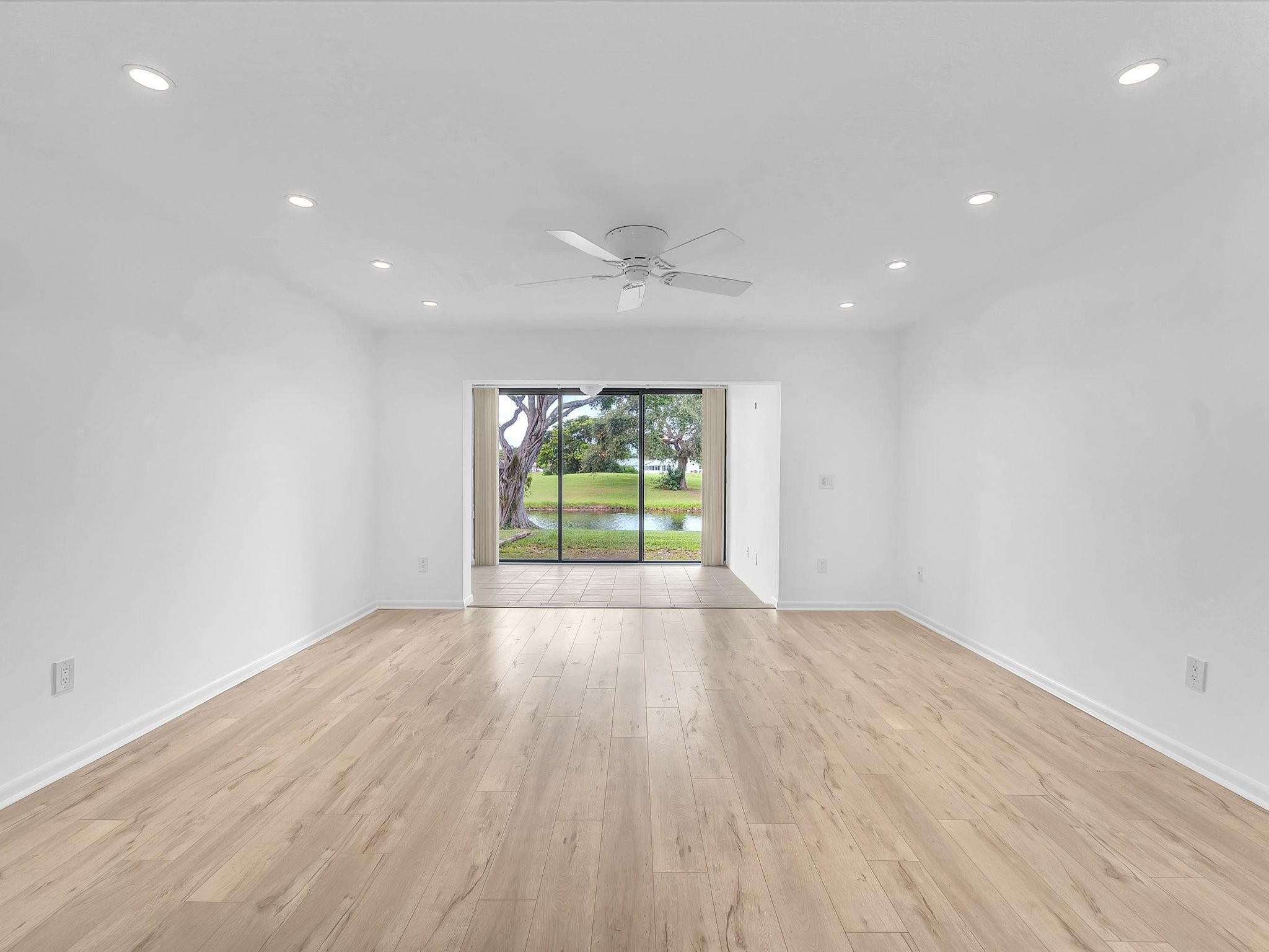 9290 Vista Del Lago, Unit E Boca Raton, FL 33428 - Photo 8 of 39 Living room and glass enclosed den