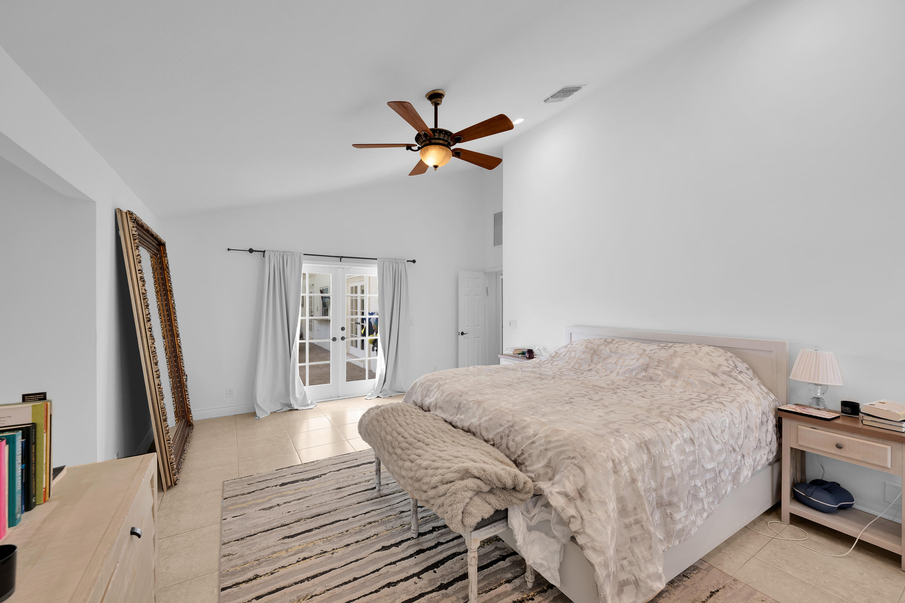 4320 St Charles Way Boca Raton, FL 33434 - Photo 16 of 34 a bedroom with a bed and a flat screen tv