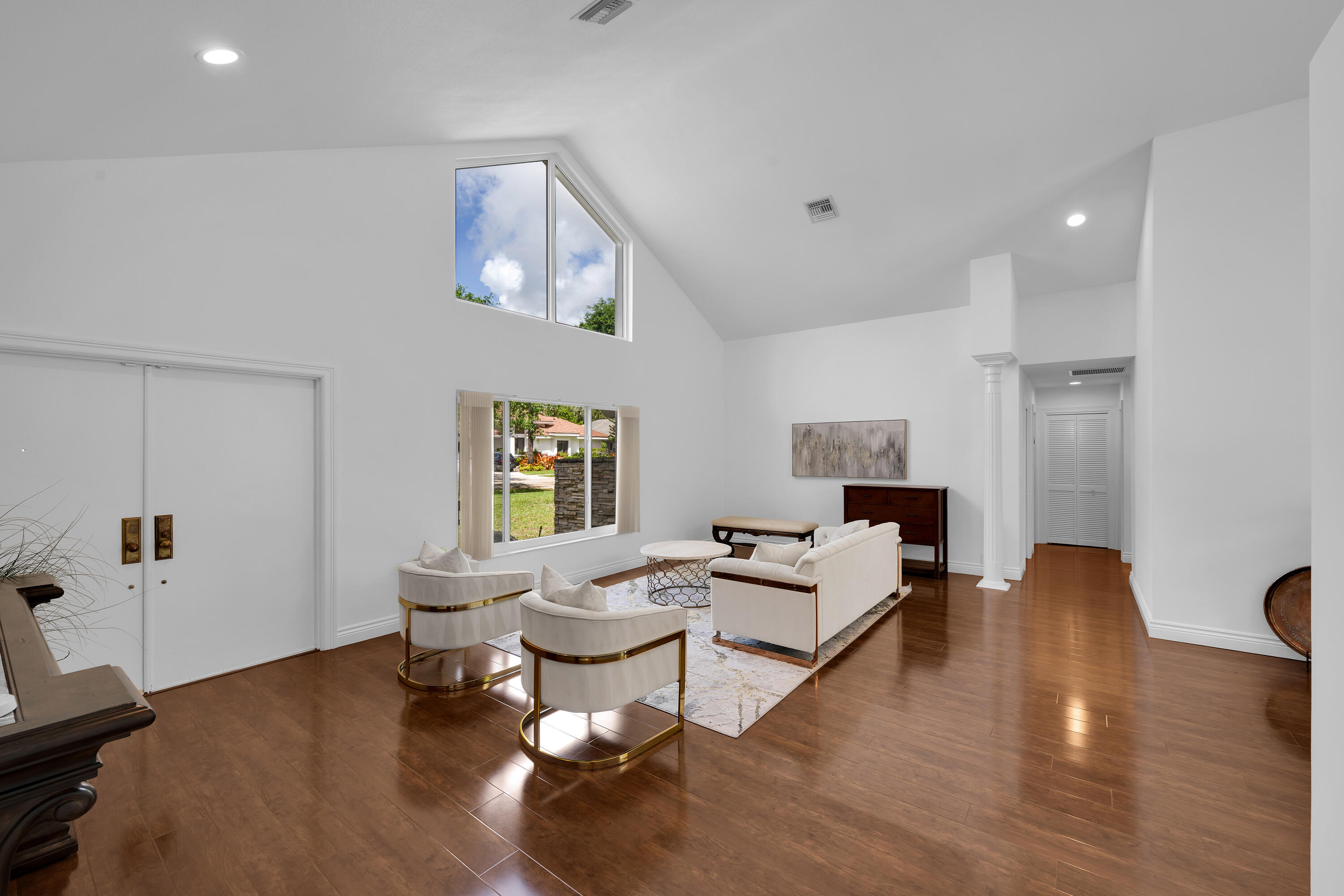 4320 St Charles Way Boca Raton, FL 33434 - Photo 2 of 34 a living room with fireplace furniture and a wooden floor