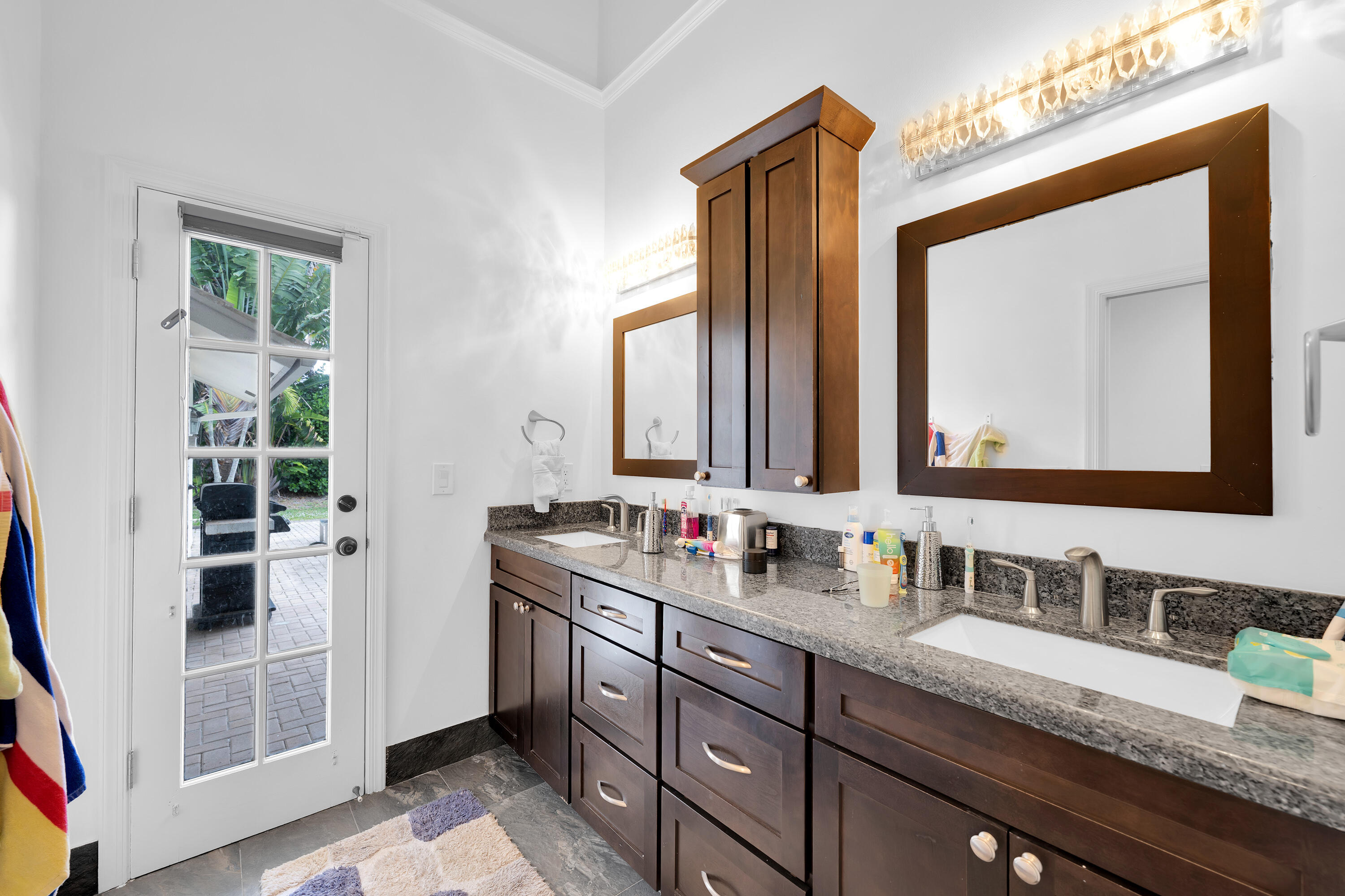 4320 St Charles Way Boca Raton, FL 33434 - Photo 24 of 34 a bathroom with a double vanity sink and a mirror