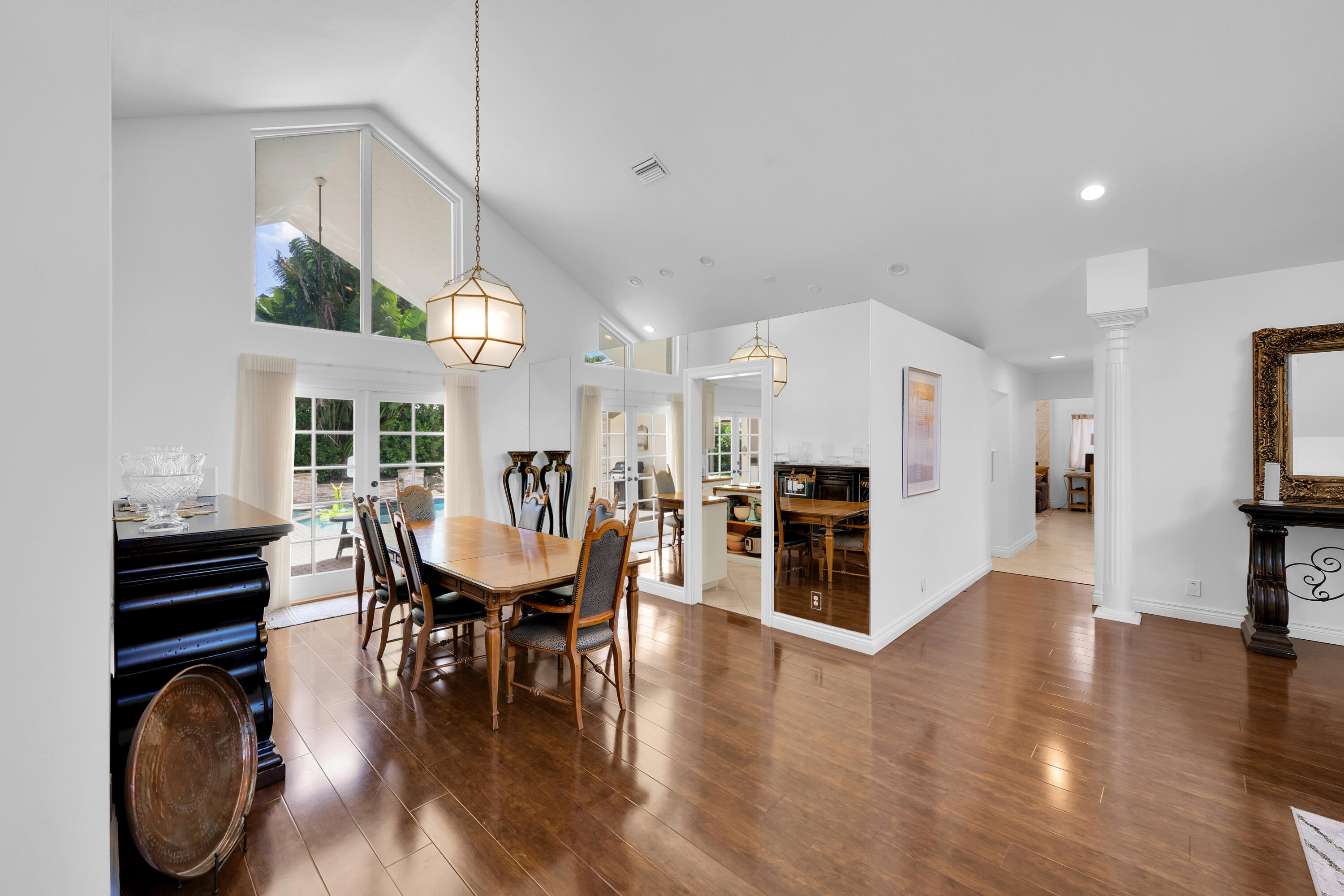 4320 St Charles Way Boca Raton, FL 33434 - Photo 6 of 34 a dining room with furniture entryway and wooden floor