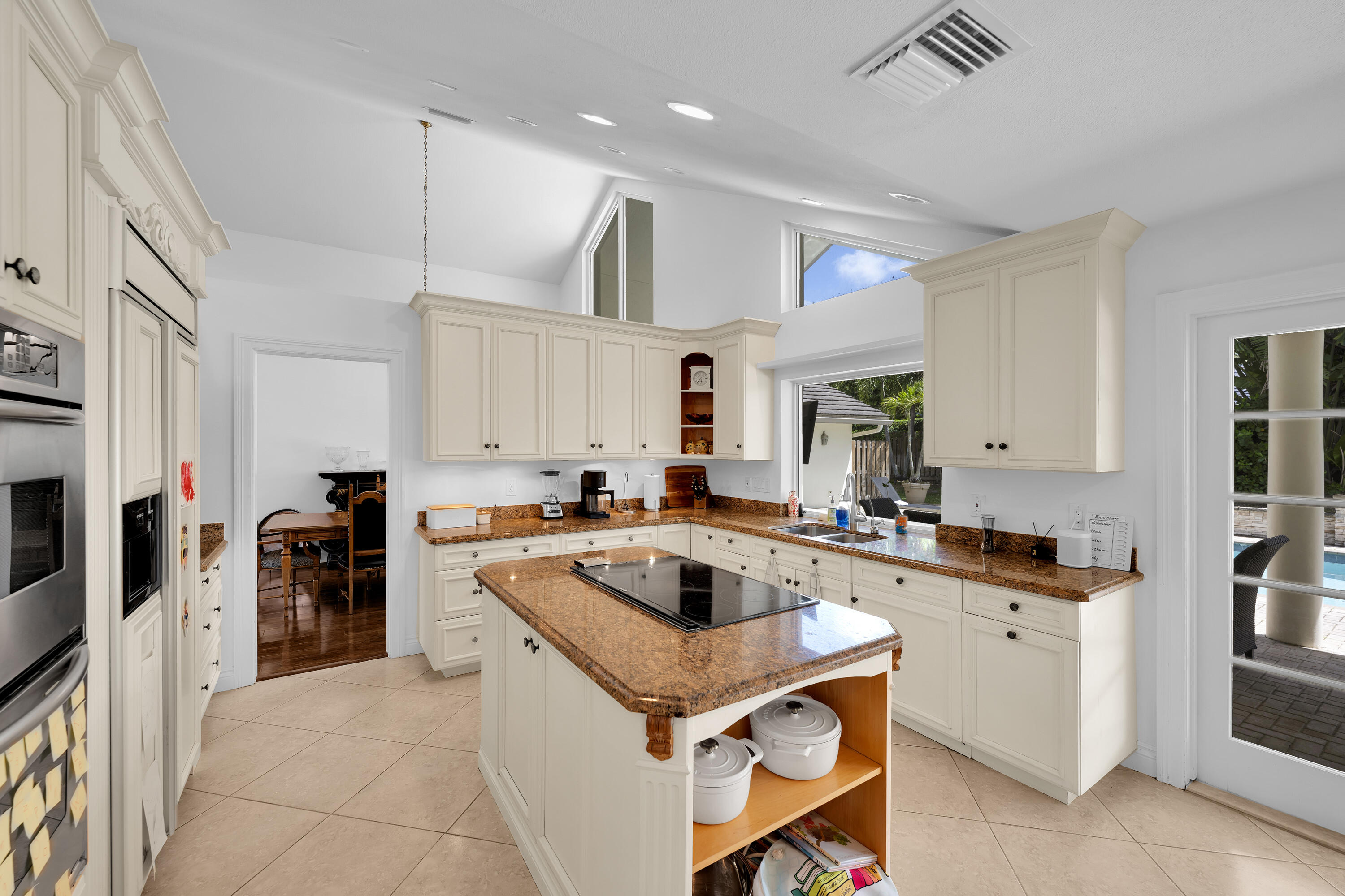4320 St Charles Way Boca Raton, FL 33434 - Photo 9 of 34 a kitchen with a stove sink and cabinets