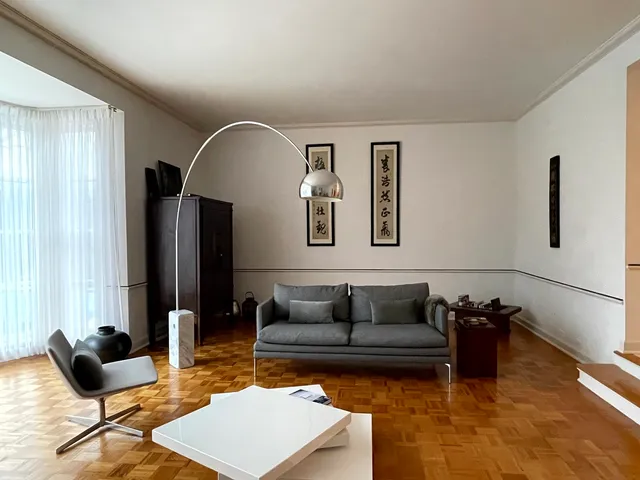 a living room with furniture rug and window