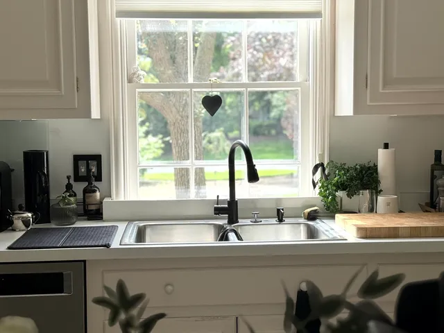a bathroom with a sink and a window