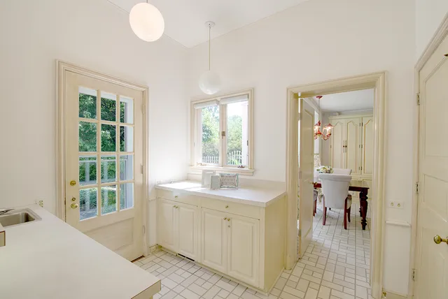 a en suite bathroom with a sink mirror and a bath tub