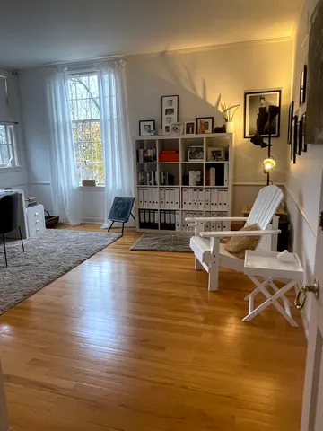 a living room with fireplace furniture and a flat screen tv