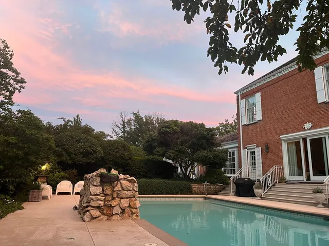 a view of a swimming pool with a patio