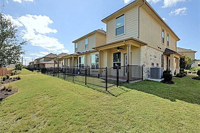 14001 Avery Ranch Boulevard, Unit 801 Austin, TX 78717 - Photo 20 of 26 Green lawns and inviting patios create a delightful outdoor living experience.