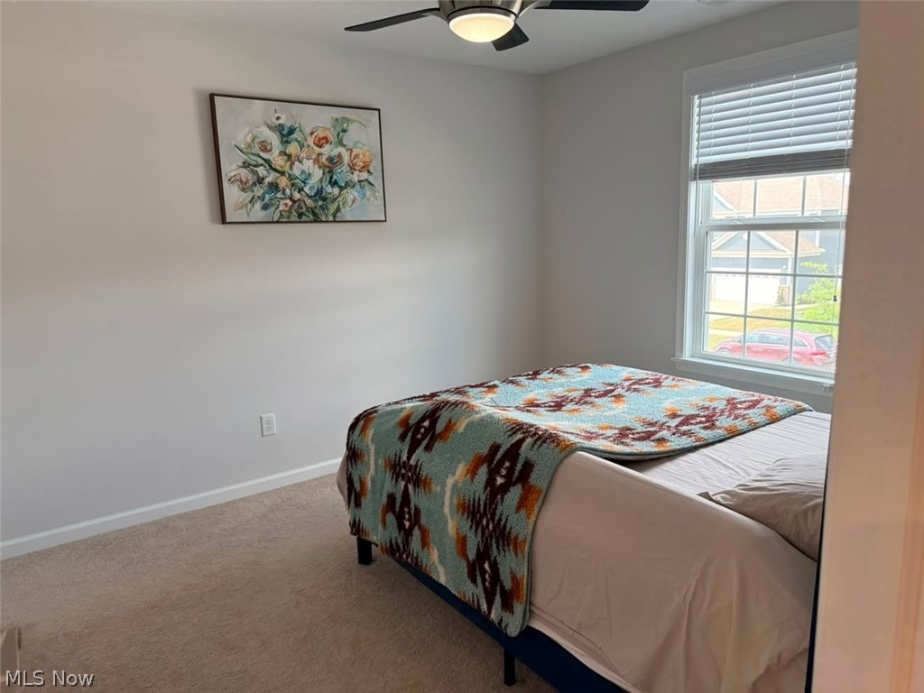 863 River Run Road Aurora, OH 44202 - Photo 33 of 47 Bedroom featuring neutral wall paint, carpet flooring, a window with blinds, and a ceiling fan with integrated lighting