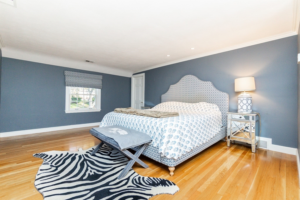 66 Suffolk Road Wellesley, MA 02481 - Photo 12 of 29 a bedroom with a bed and a night stand