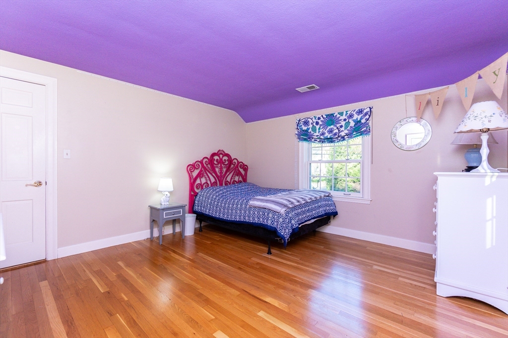 66 Suffolk Road Wellesley, MA 02481 - Photo 17 of 29 a bedroom with a bed and a dresser