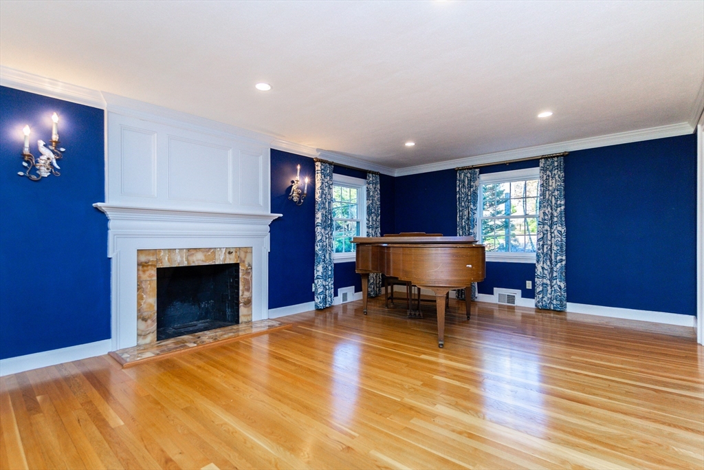66 Suffolk Road Wellesley, MA 02481 - Photo 2 of 29 a living room with furniture and a fireplace