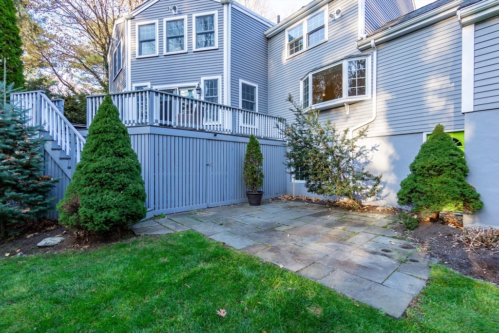 66 Suffolk Road Wellesley, MA 02481 - Photo 23 of 29 a view of a back yard of the house