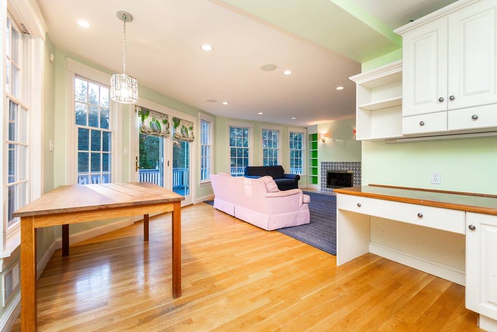 66 Suffolk Road Wellesley, MA 02481 - Photo 4 of 29 a living room with furniture a large window with kitchen view