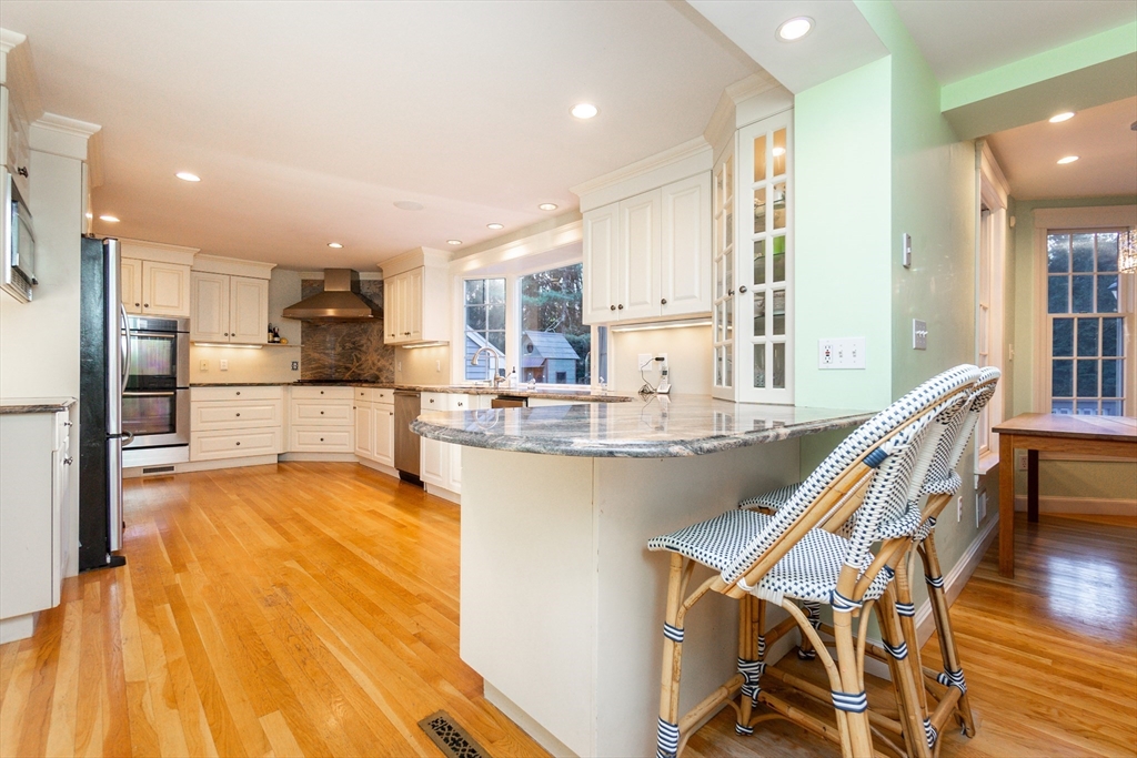 66 Suffolk Road Wellesley, MA 02481 - Photo 5 of 29 a kitchen with stainless steel appliances granite countertop a sink and cabinets
