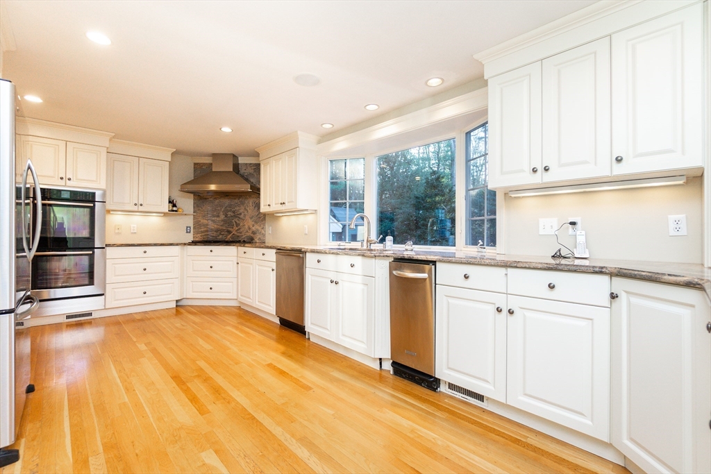 66 Suffolk Road Wellesley, MA 02481 - Photo 6 of 29 a kitchen with granite countertop a sink cabinets stainless steel appliances and a window