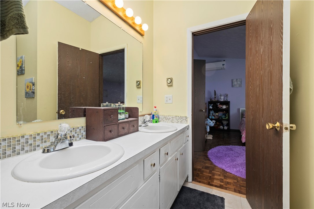 2565 Abbe Road North Sheffield Lake, OH 44054 - Photo 24 of 32 Bathroom with double vanity