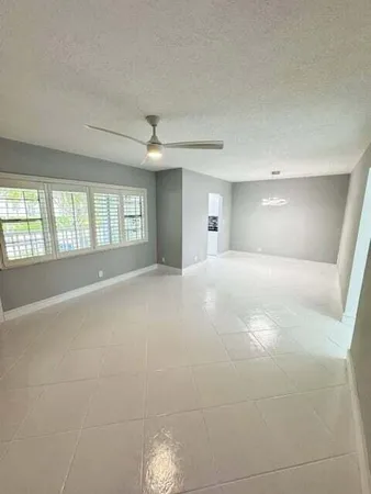 a view of an empty room with a window
