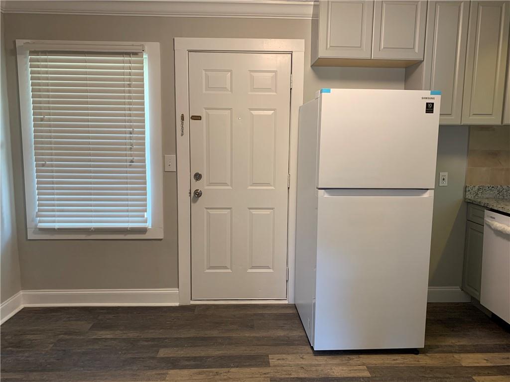 1261 Concord Road Southeast Smyrna, GA 30080 - Photo 23 of 50 a white refrigerator freezer sitting in a kitchen