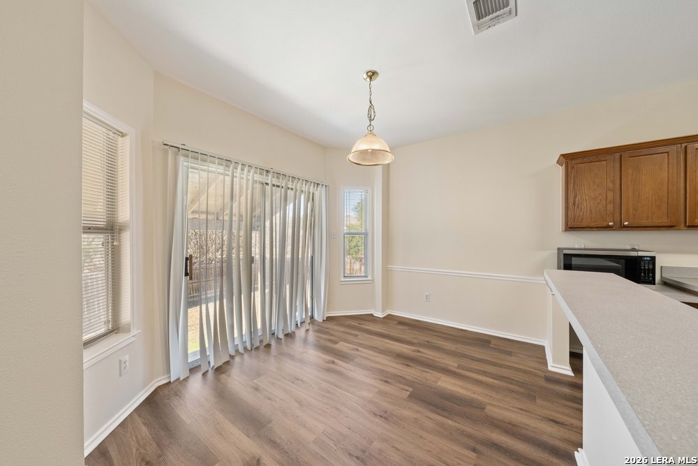 12319 Stable Rd Drive San Antonio, TX 78249 - Photo 13 of 34 a view of a room with wooden floor and stairs