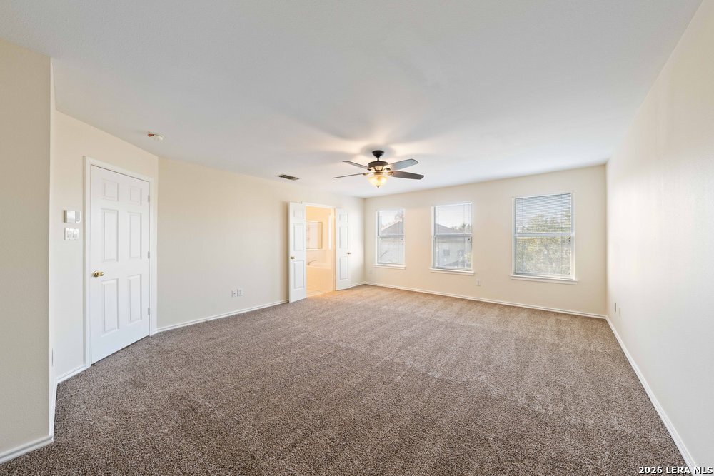 12319 Stable Rd Drive San Antonio, TX 78249 - Photo 23 of 34 a view of an empty room with a window