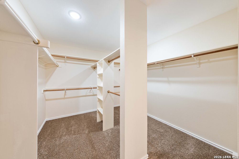12319 Stable Rd Drive San Antonio, TX 78249 - Photo 26 of 34 a view of walk in closet with empty racks