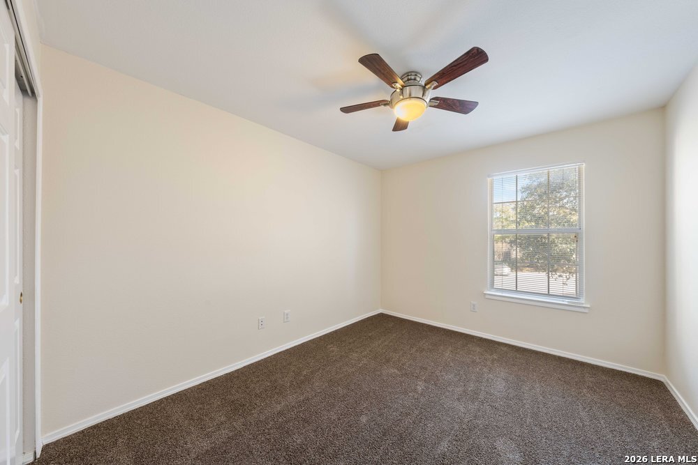 12319 Stable Rd Drive San Antonio, TX 78249 - Photo 30 of 34 a view of a big room with windows and chandelier fan