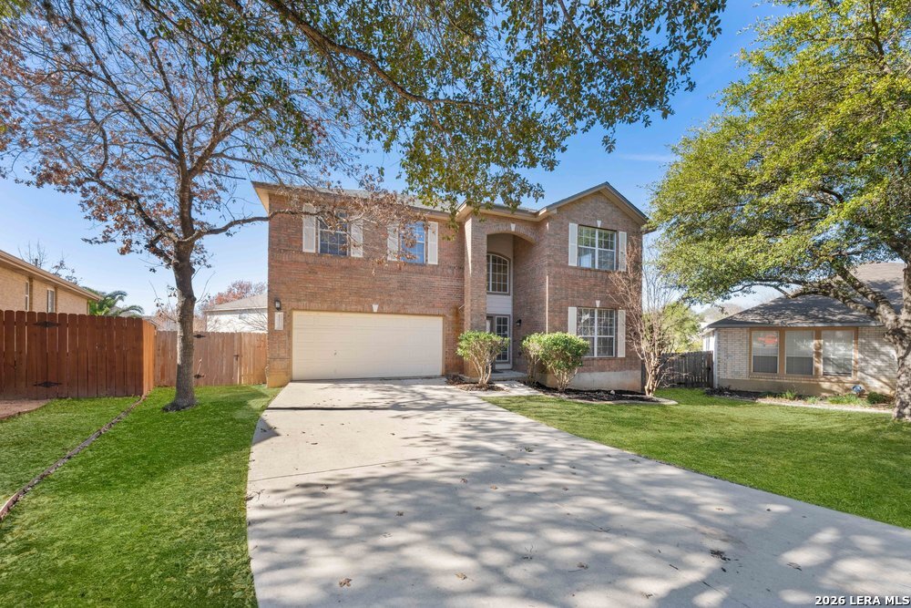12319 Stable Rd Drive San Antonio, TX 78249 - Photo 3 of 34 a front view of house with yard and green space