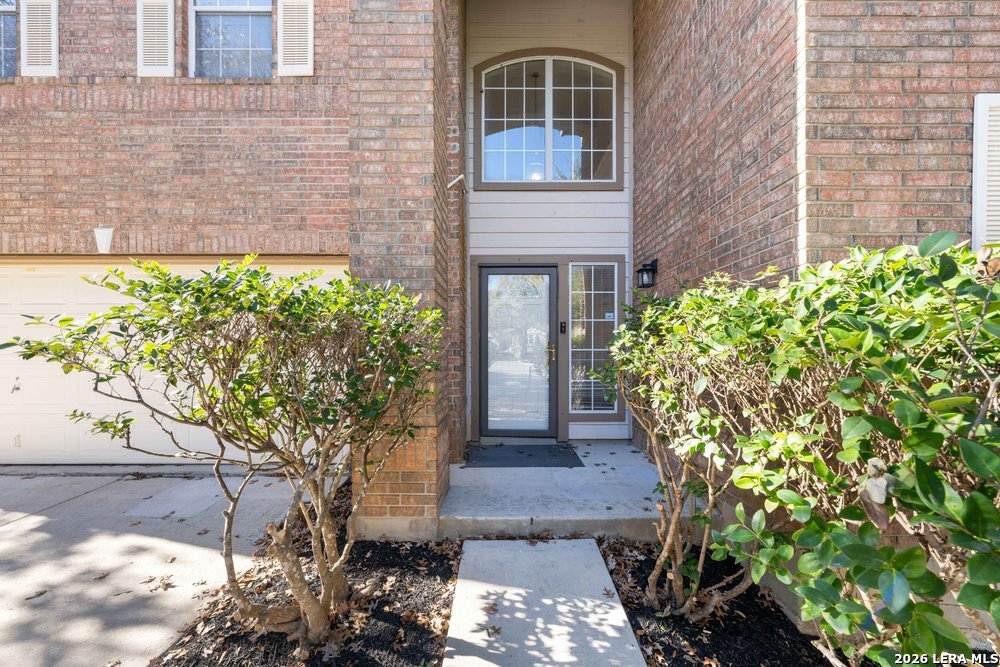 12319 Stable Rd Drive San Antonio, TX 78249 - Photo 4 of 34 a front view of a house with a yard