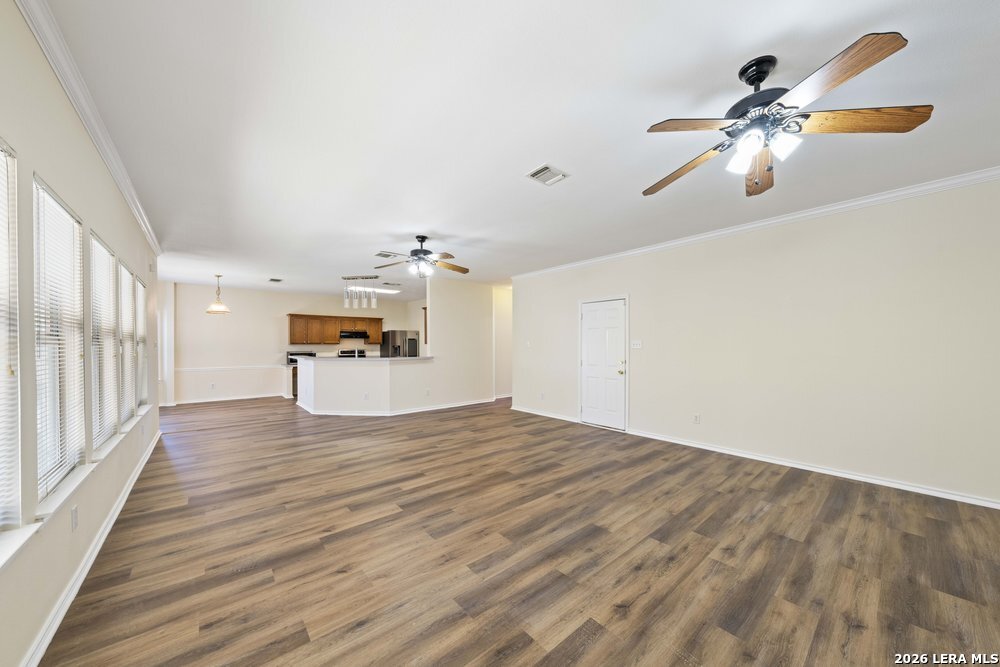 12319 Stable Rd Drive San Antonio, TX 78249 - Photo 10 of 34 a view of empty room with wooden floor