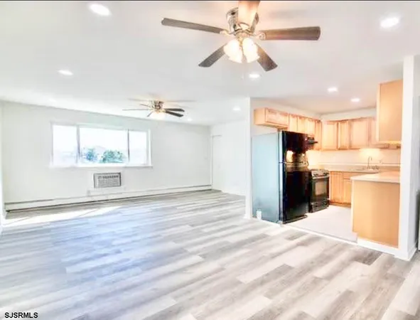 a view of a kitchen with a sink and a kitchen view
