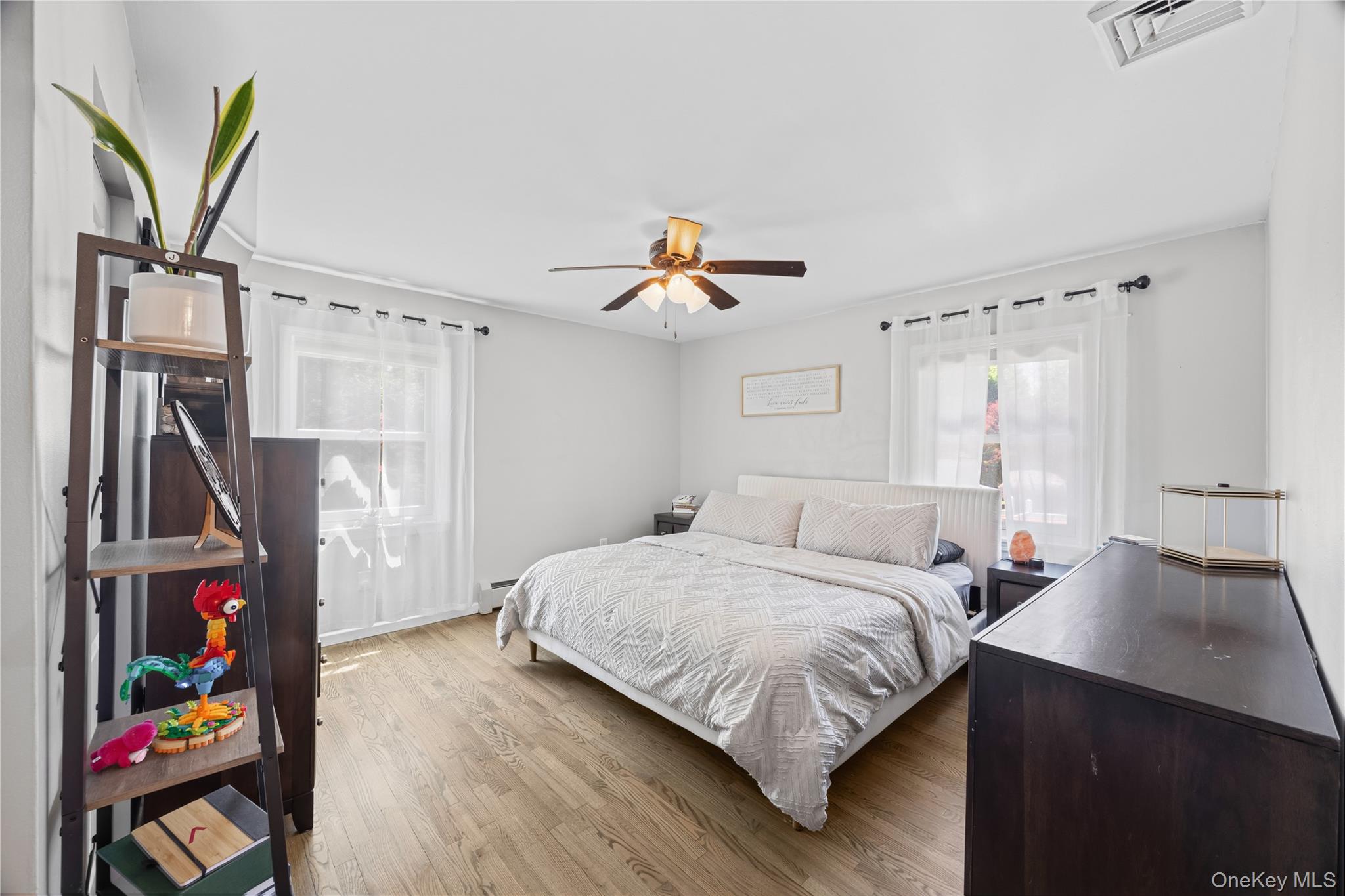 69 Silver Spring Road New Windsor, NY 12553 - Photo 12 of 20 a bedroom with a bed and wooden floor