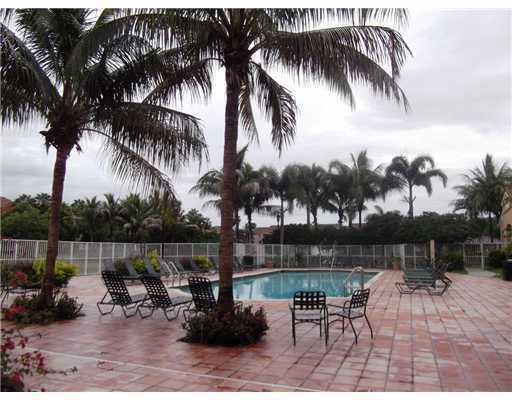 3870 Lyons Road, Unit 1018 Coconut Creek, FL 33073 - Photo 2 of 5 a view of a backyard with a patio